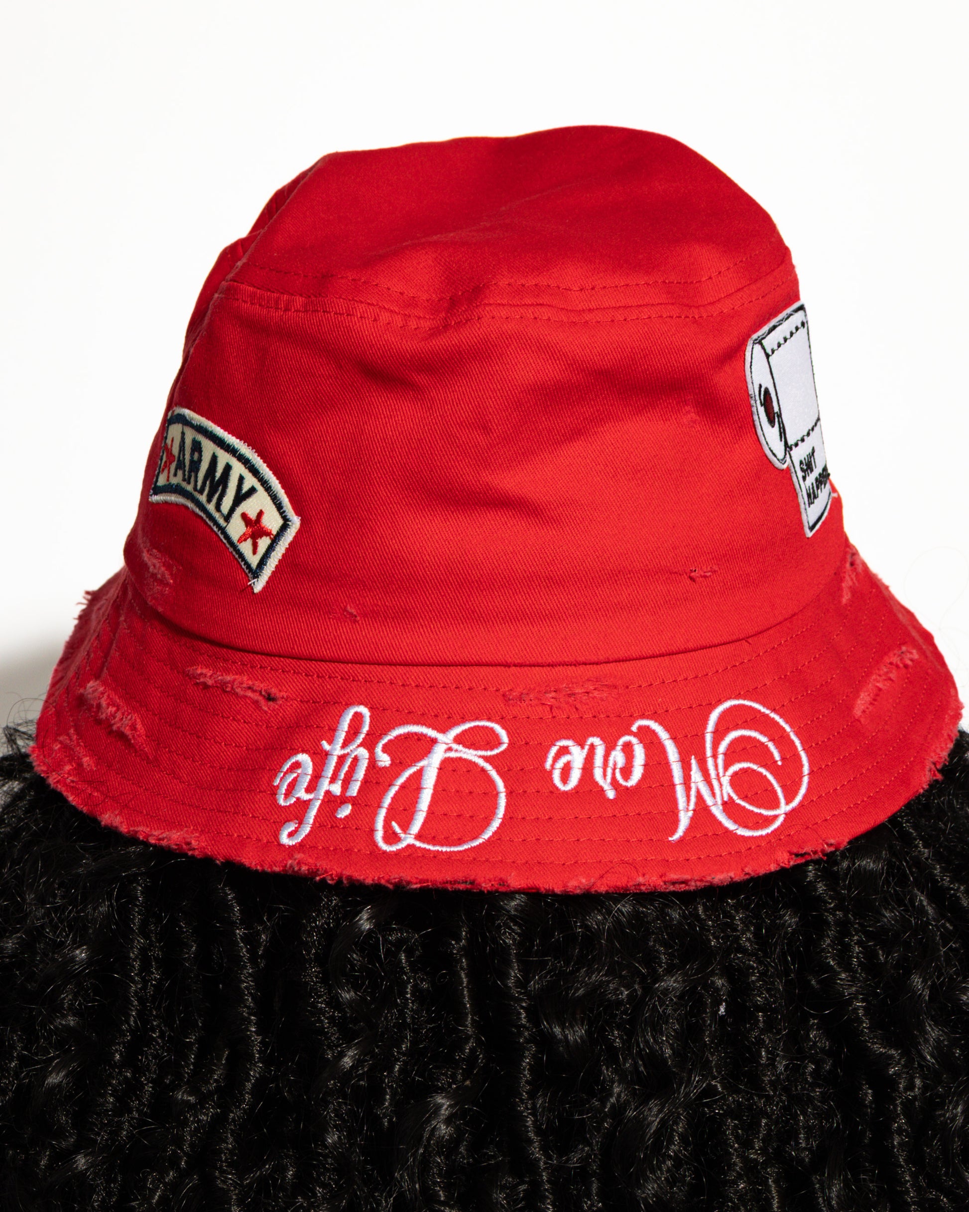 More Life CLT R&B Patchwork Distressed Bucket Hat Red – front view on model showing More Life Charlotte NC logo and R&B microphone patch close-up