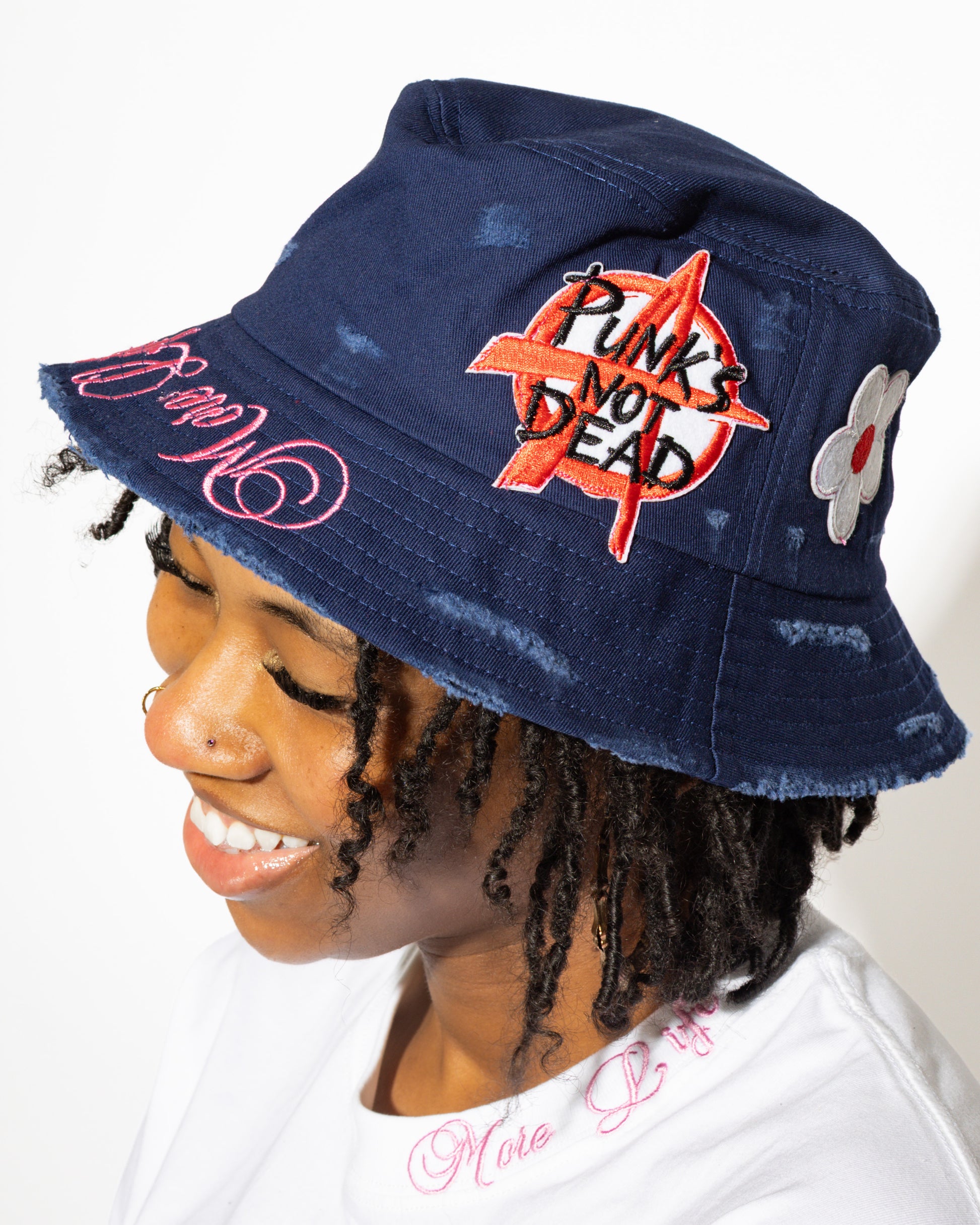 More Life CLT Charlotte Patchwork Distressed Bucket Hat Navy Blue – side view showing Punk's Not Dead and daisy patches
