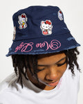 More Life CLT Hello Kitty Patchwork Distressed Bucket Hat Navy Blue – front view on model showing Hello Kitty patches and pink More Life brim embroidery